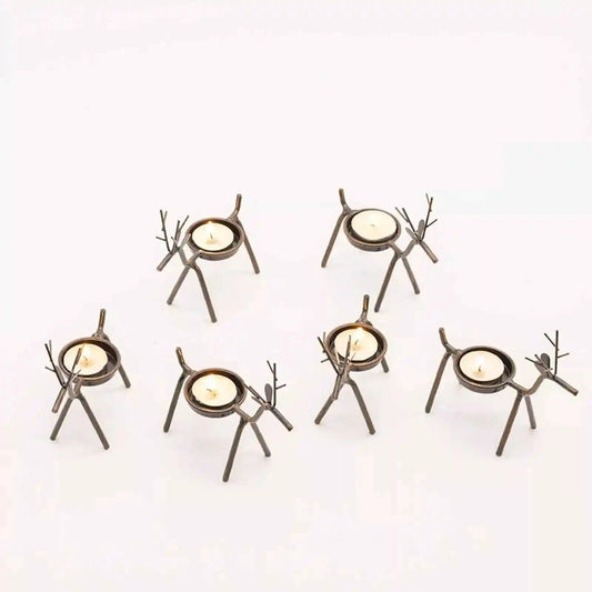 Set of six unique candle holders on a white background