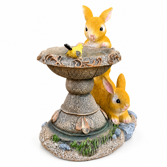 Solar rabbit bird bath garden ornament on a white background