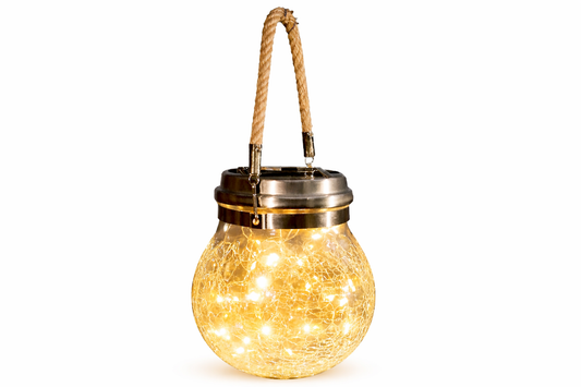 A spherical crackle glass solar lantern filled with warm white LED fairy lights, featuring a natural rope handle and a brass metal lid, shown against a plain white background.