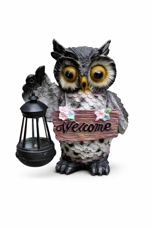 Owl figurine holding a lantern and 'Welcome' sign on a white background