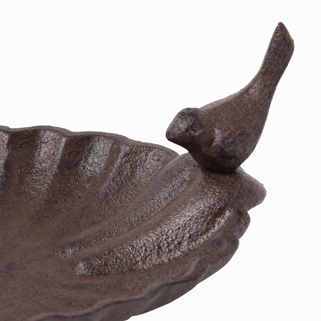 Decorative metal leaf with a bird on a white background