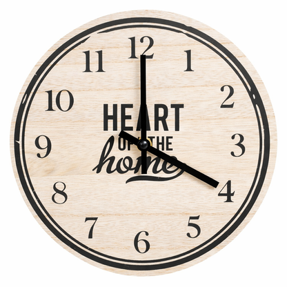 Wooden wall clock with 'Heart of the Home' text on a white background