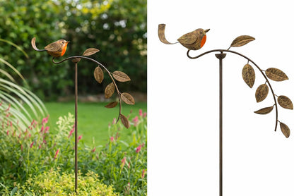 Metal garden stake with bird design in a garden setting