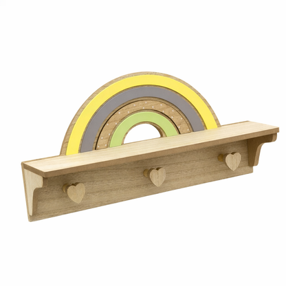 Wooden shelf with rainbow-shaped hooks on a white background