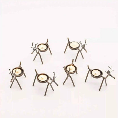 Set of six unique candle holders on a white background