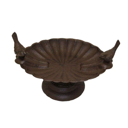 Decorative metal object with leaf designs on a white background