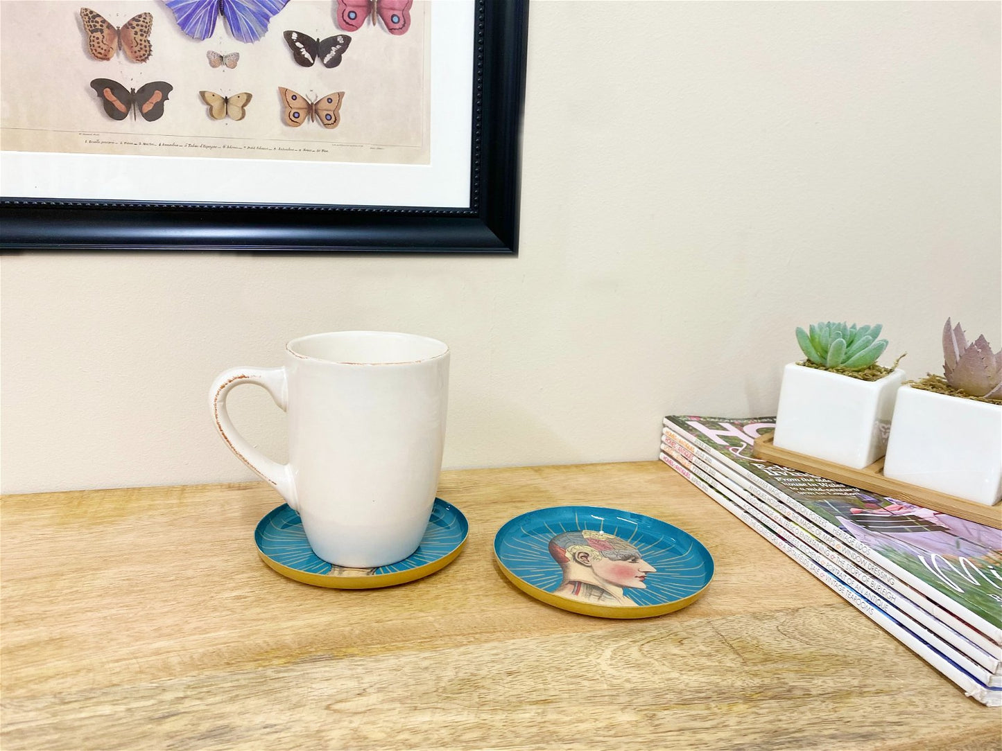 Set of Two Metal Palm and Phrenology Head Round Coasters